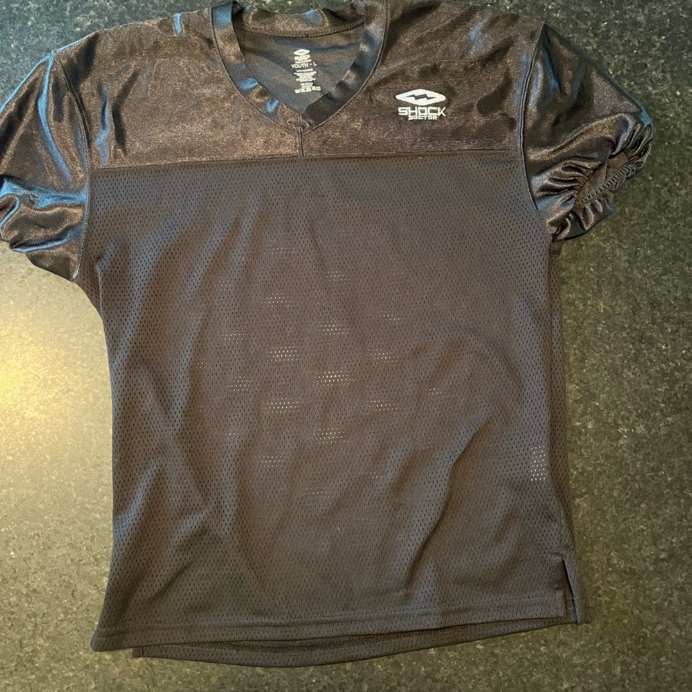 Football practice jersey and padded pants